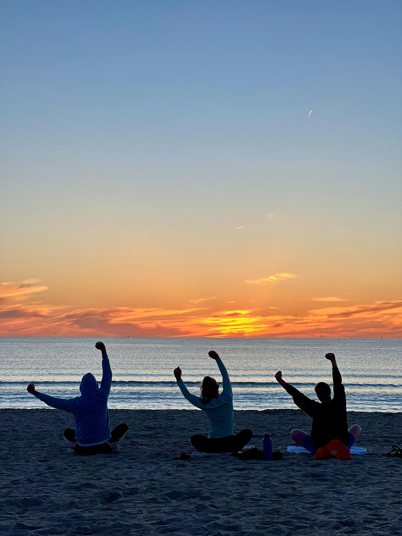 Private group gathering at sunset on the beach